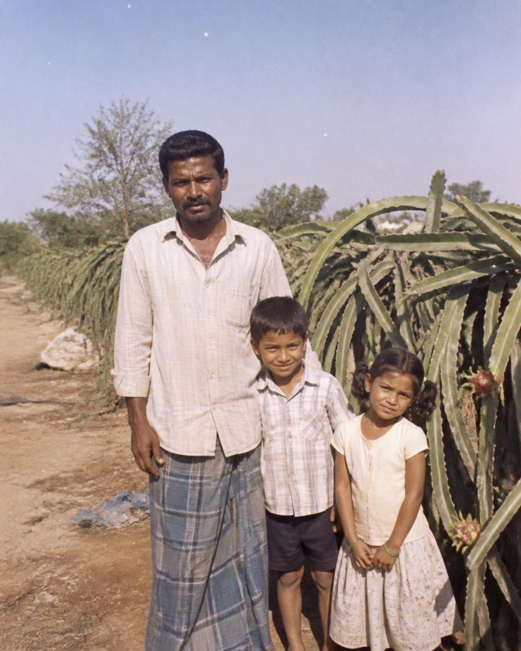 The founding family of HanJot Farms in their dragon fruit orchard